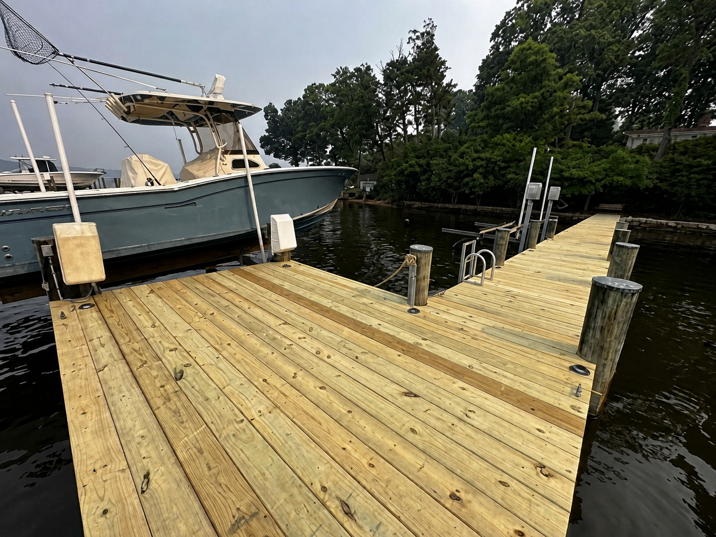 Freshly resurfaced wooden dock over the water